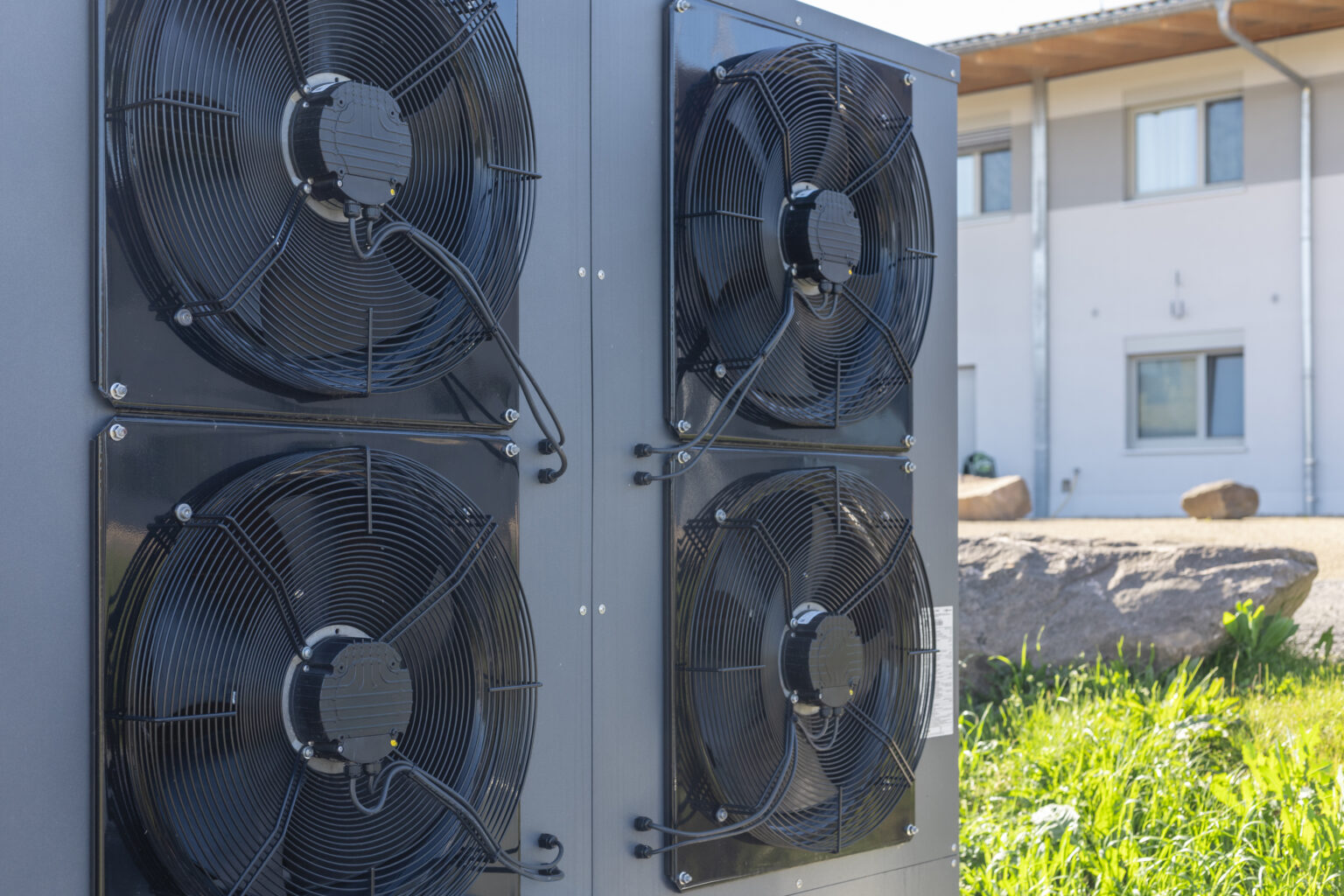Commercial air source heat pump system installed outdoors. These systems are common in energy-efficient HVAC solutions and are increasingly used in modern sustainable architecture.