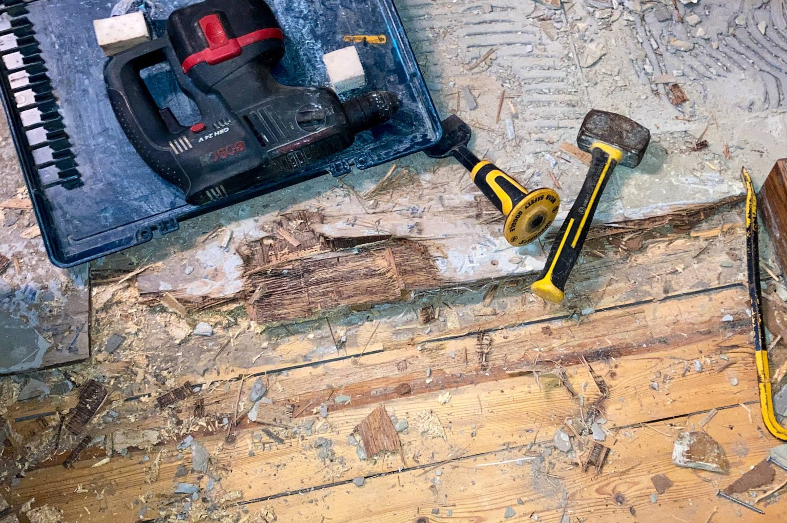 demolition-equipment-on-wooden-floor-with-debris-2026-01-05-04-56-10-utc