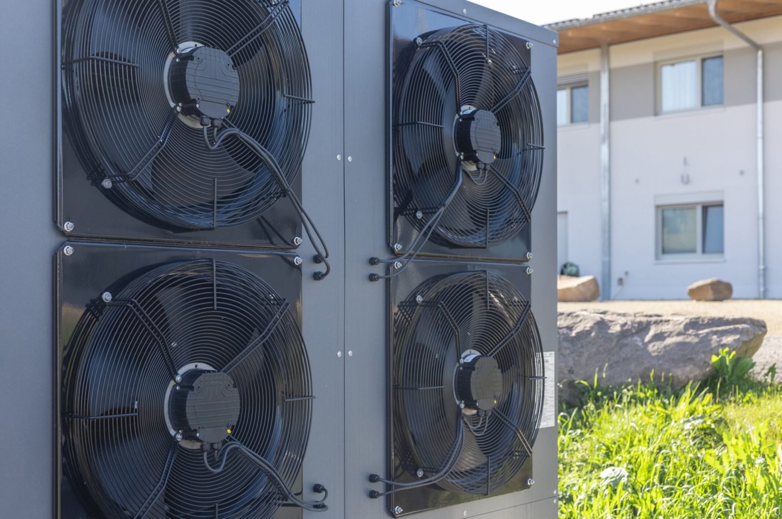 Commercial air source heat pump system installed outdoors. These systems are common in energy-efficient HVAC solutions and are increasingly used in modern sustainable architecture.